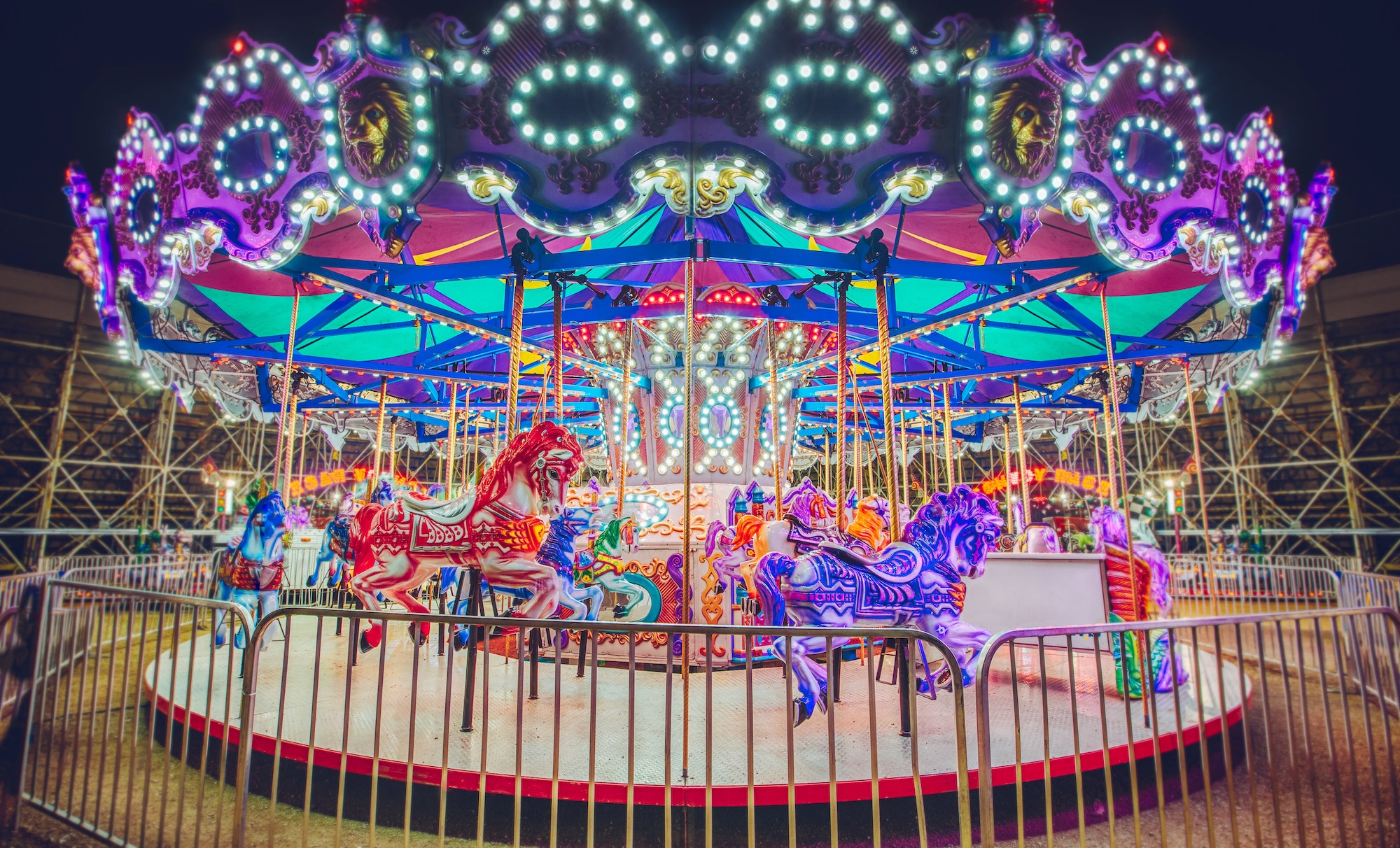 Fair.Carousel with horses. Horse rides kids carousel at the fair